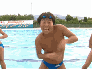 dancing asian. hes dancing what else can i say....oh yeah hes in a speedo and by a pool.