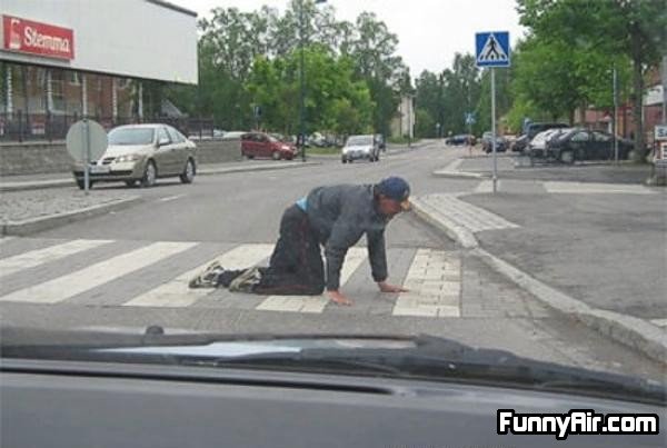 Drunk Guy Trying To Cross The Street. .. crawl dont walk to the other sid eof the road!!! O.o