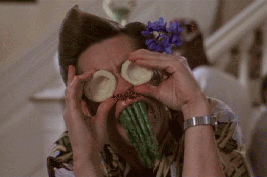 Psychedelic gif of Jim Carrey goofing with vegetables on his face